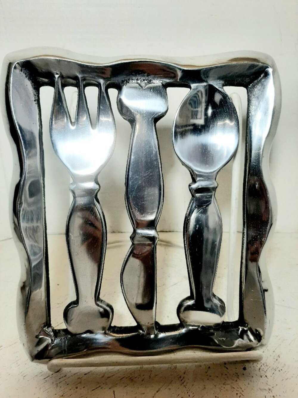 Metal footed Diner Style Cutlery Footed Trivet by Abbott.